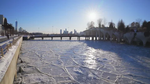 Thousands of ice floes wrap up the Little Island Park on Hudson River Stock Footage 336694280