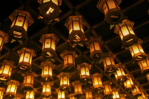 Thousands of lanterns hanging on the ceiling of Buddhist temple Shrine. Stock Photos