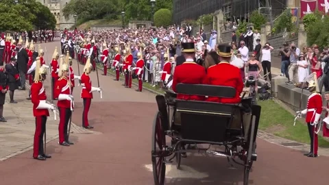 Thousands line streets of Windsor Castle for annual Royal Garter procession - H Video stock 336977774