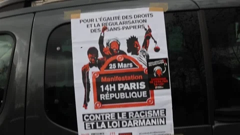 Thousands march in Paris against controversial immigration law, París, FR - 26 M Stock Footage 236803471