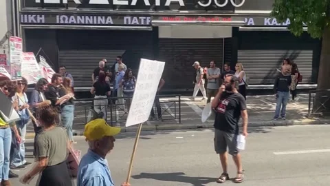 Thousands protest in Athens against the increase in working hours to a maximum o Stock Footage 318170738