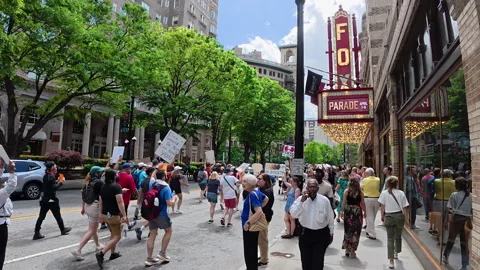 Thousands protest with signs at Atlanta Hands Off march Stock Footage 306955266