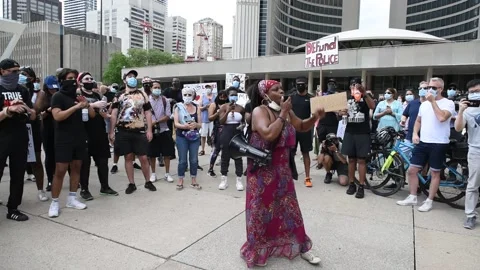 Thousands take to Toronto streets to protest anti-black racism, police brutality Stock Footage 132087832