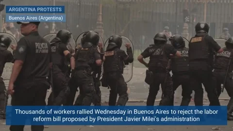 Thousands of workers take to Buenos Aires streets to protest Milei's labor refor Video stock 328702379