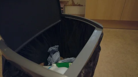 Thowing plastic trash into a rubbish bin Stock Footage 115254561