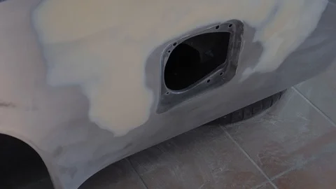 Thr car is in the process of repair. Stock Footage 118023796