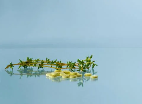 A thrash of thyme and vegetable tablets lozenges. Stock Photos
