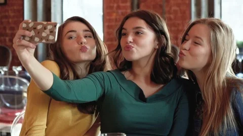 Thre young girlfriends make selfie photo Stock Footage 73164512