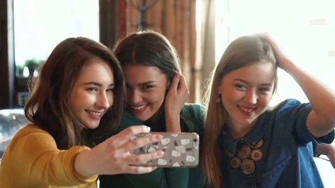 Thre young girlfriends make selfie photo Stock Footage 73165230