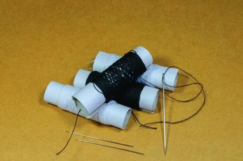 Thread  and needle Stock Photos