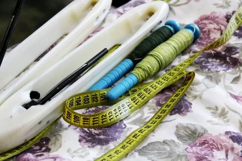 Thread and ruler wound on a spool. tailor tools Stock Photos