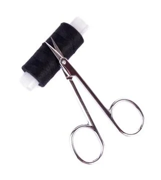 Thread and scissors Stock Photos