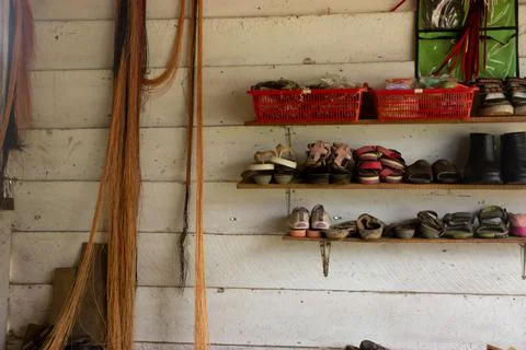 Thread and used shoes on display Stock Photos