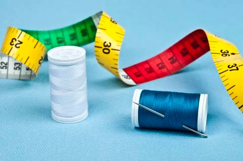 Thread on blue material background 库存照片