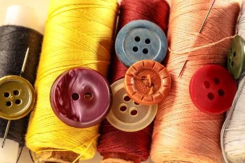 Thread bobbins, buttons and needles 写真素材