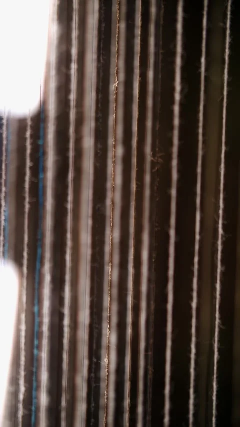 Thread. close-up. dyeing and drying of threads for further fabric production by Stock Footage 315365306