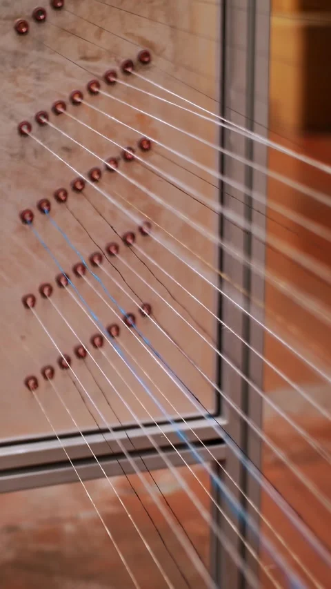 Thread. close-up. dyeing and drying of threads for further fabric production by Stock Footage 318683619