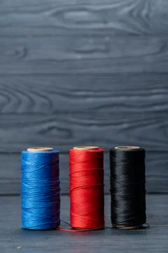 Thread coils black red and blue Foto stock