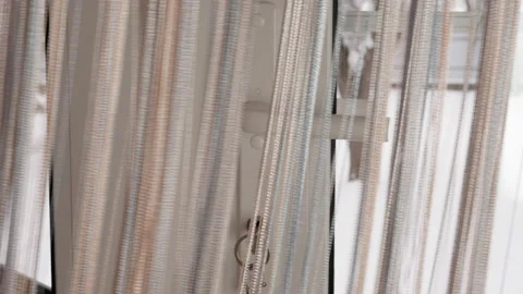 Thread curtain falls on a door Stock Footage 147654522