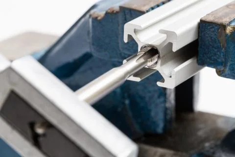 Thread cutting with a vise and taps Stock Photos