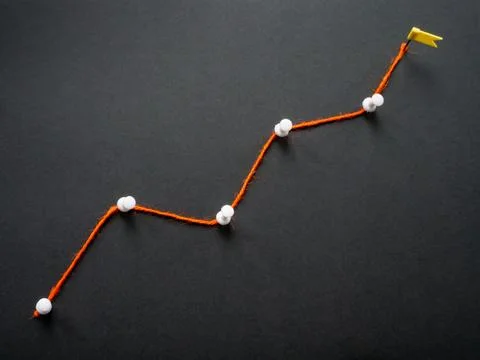 A thread in the form of growing graph as a symbol of business success. 스톡 사진