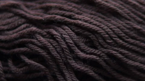 Thread for knitting. close up video of dark brown thread 動画素材 166863640
