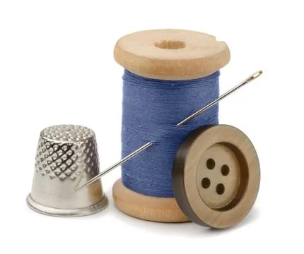 Thread, needle  and thimble Stock Photos