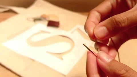 Thread the needle with a S backgound Stock Footage 145461376