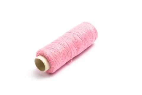 Thread with a needle on a white background. close up Stock Photos