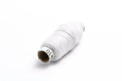 Thread with a needle on a white background. close up Stock Photos