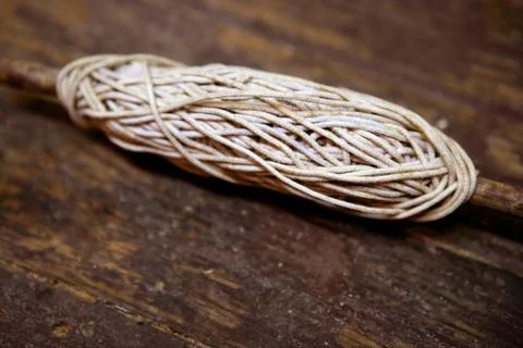 Thread old spool over aged wooden Stock Photos