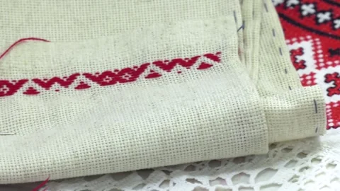 Thread with a red thread stuck in a linen cloth Stock Footage 95248912