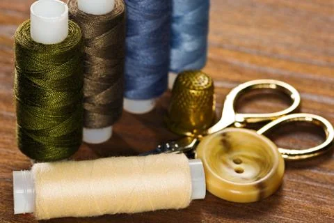 Thread reels, scissors and thimble Stock Photos