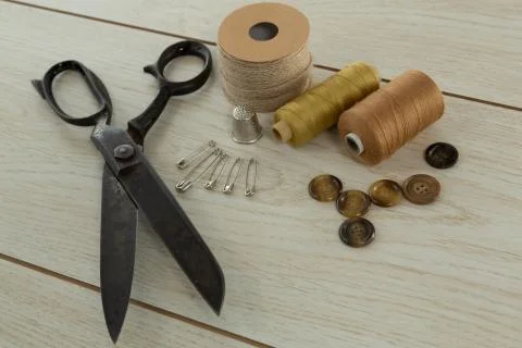 Thread roll and various equipments on a textile Stock Photos