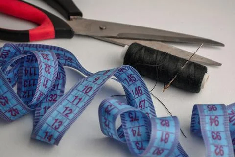 Thread scissors centimeter on the table 写真素材