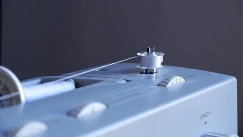 Thread from the sewing machine is rotated on the spindle Stock Footage 170790326