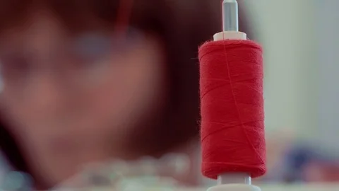 Thread on the sewing machine spinning Stock Footage 100875357