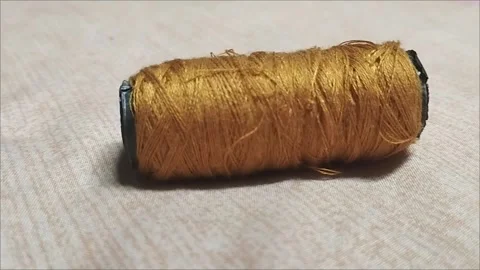 Thread for sewing yellow clothes Stock Footage 293115517