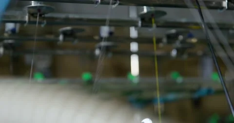 Thread shakes and vibrates on loom at factory macro Stock Footage 169056416