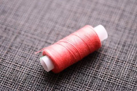 Thread spool on a table, perfect for sewing and crafting Stock Photos