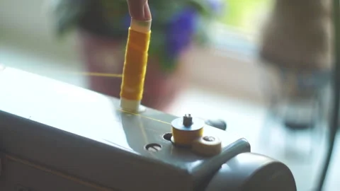 Thread spool twisting on retro sewing mashine Stock Footage 141382931