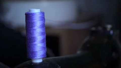 Thread From the Spool is Wound Onto a Bobbin for Sewing in a Sewing Machine Stock Footage 229537001