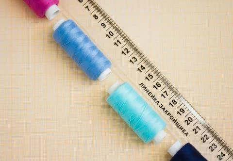 Thread in spools and cutter line for sewing Stock Photos