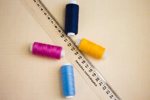 Thread in spools and cutter line for sewing Stock Photos