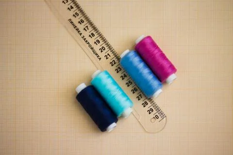 Thread in spools and cutter line for sewing Stock Photos