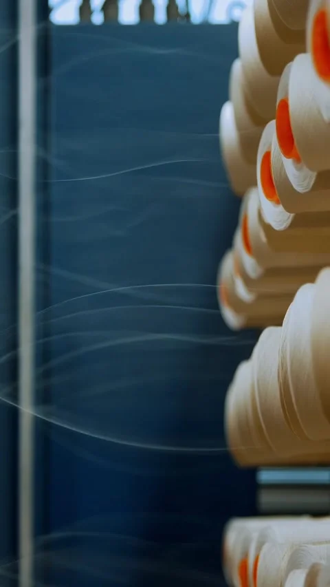 Thread spools. close-up. racks with many thread spools. the process of preparing Stock Footage 316892092