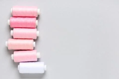 Thread spools on grey background 写真素材