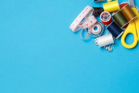 Thread Spools Tailor Equipment On Blue Background Stock Photos