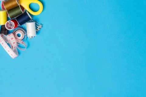 Thread Spools Tailor Equipment On Blue Background Stock Photos