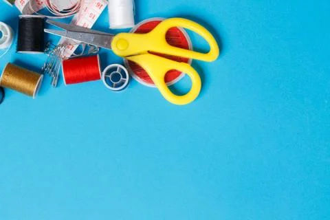 Thread Spools Tailor Equipment On Blue Background Stock Photos